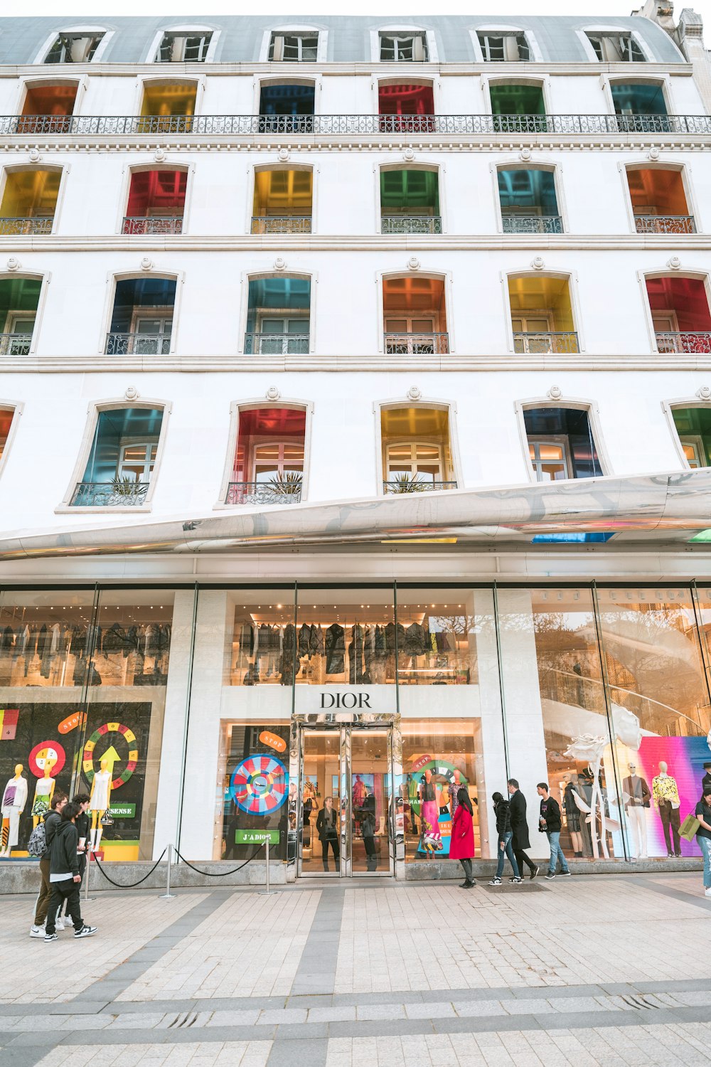 a group of people standing outside of a building