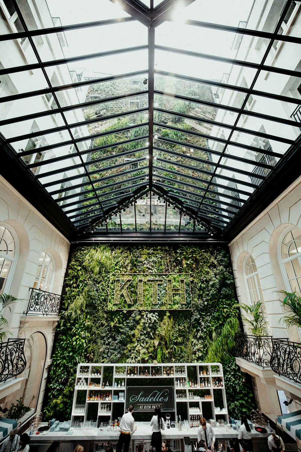 a restaurant with a green wall on the wall