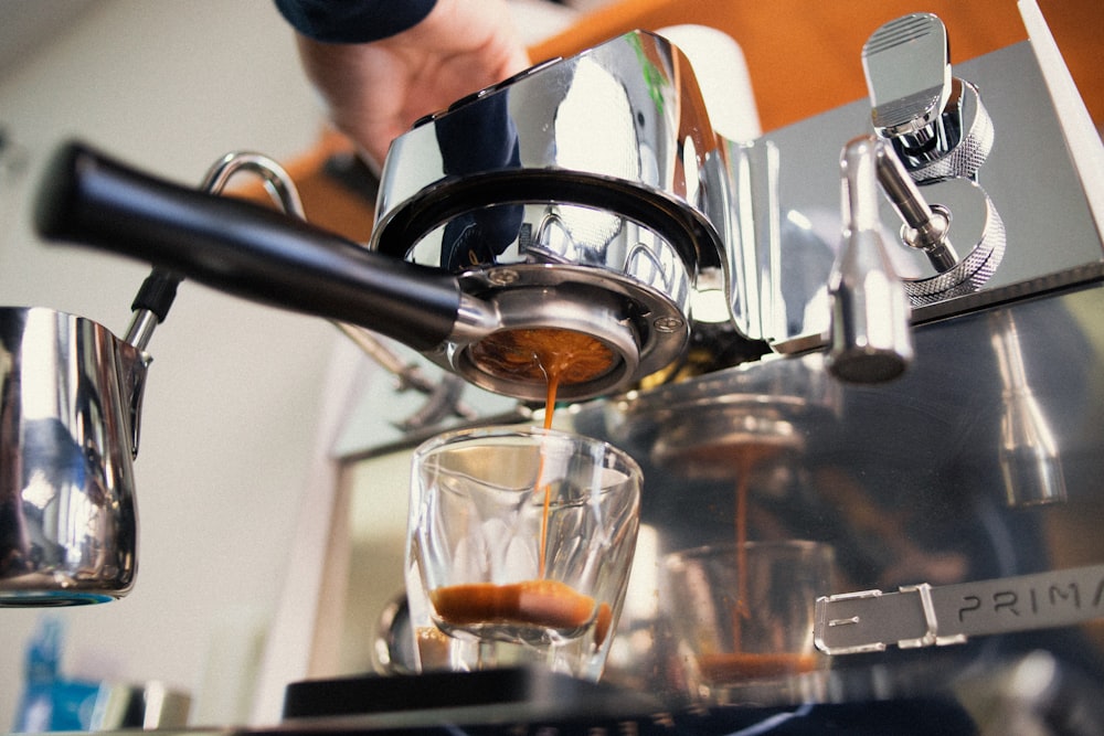 a espresso machine making a cup of coffee