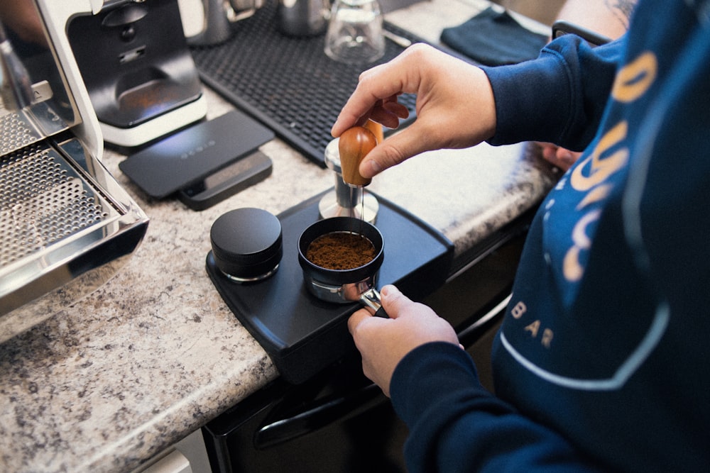 a person preparing food in a small kitchen