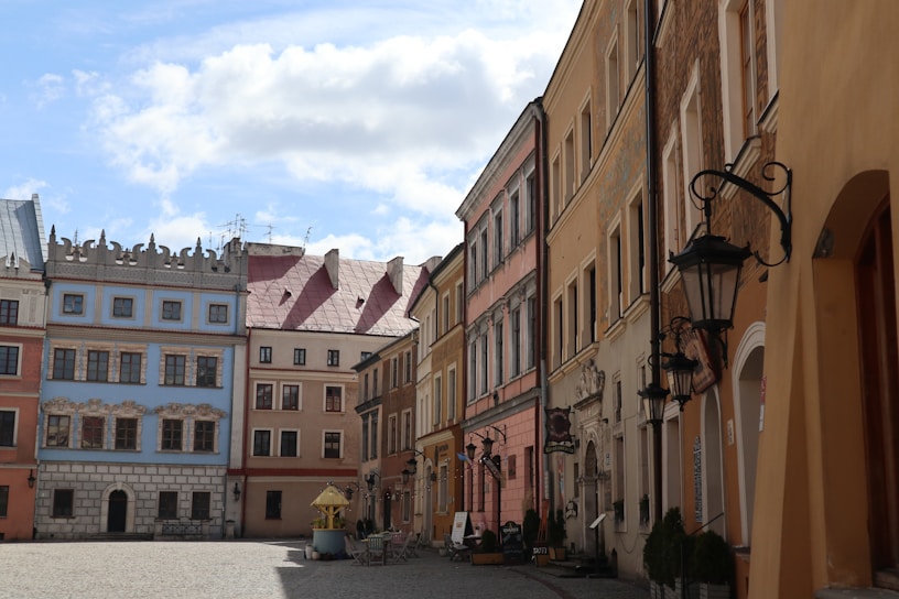 a cobblestone street lined with tall buildings