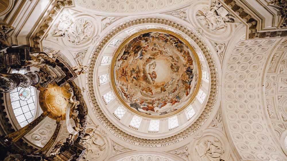 the ceiling of a building with a painting on it