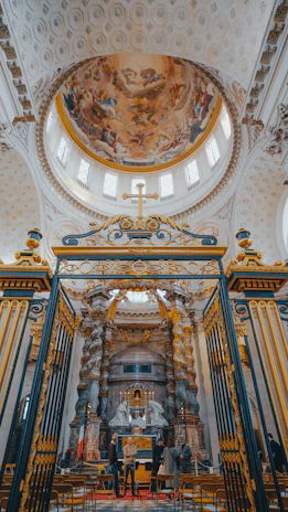 the interior of a church with a painting on the ceiling
