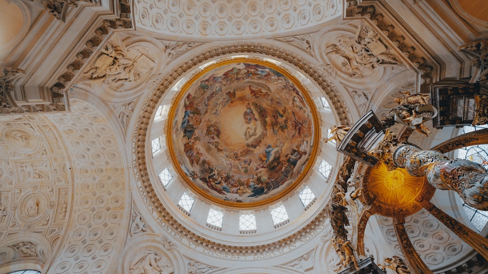 the ceiling of a church with a painting on it