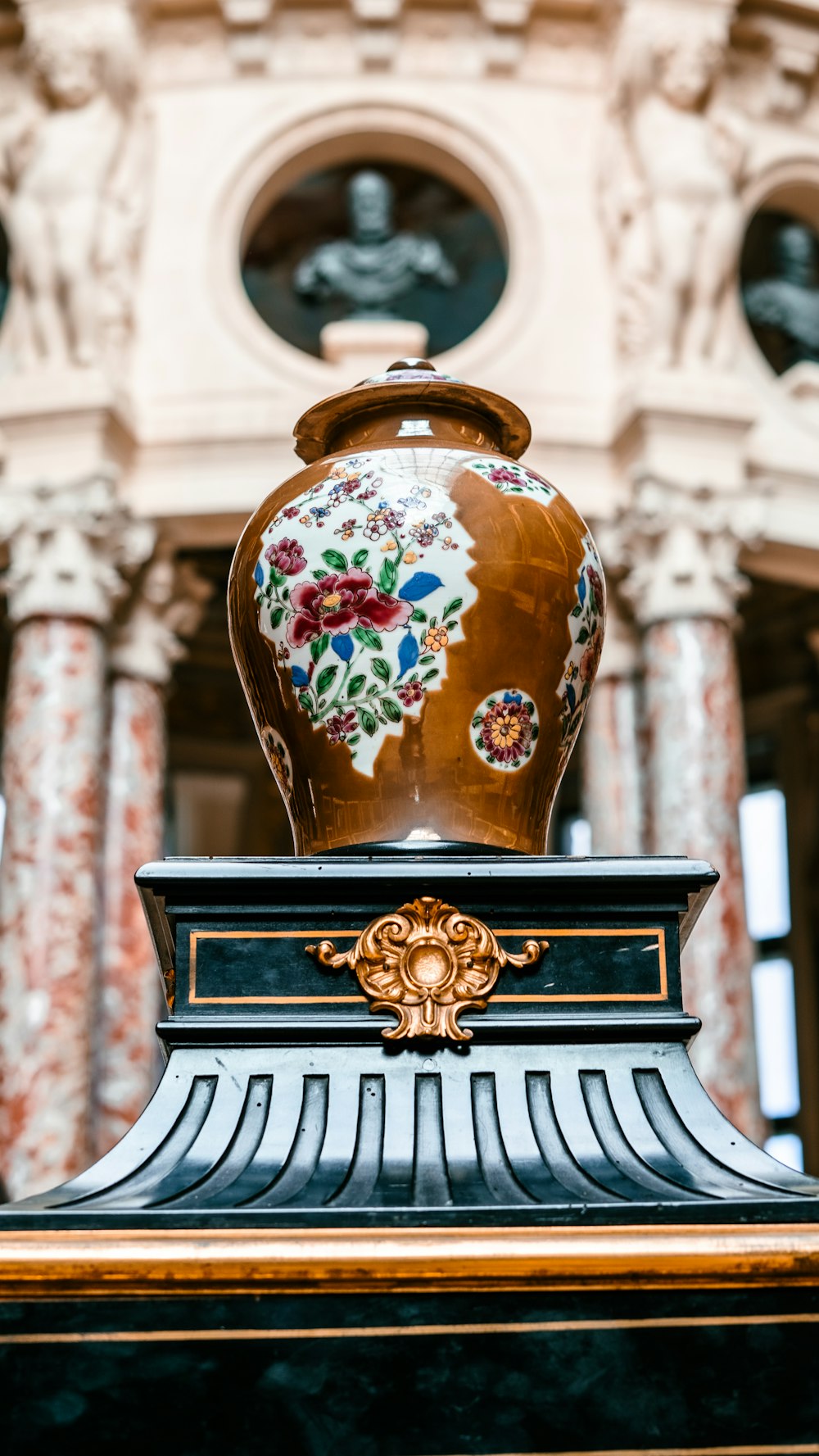 a vase sitting on top of a wooden table