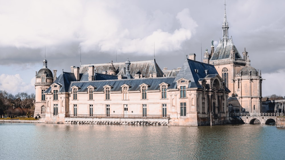 a large building sitting on top of a lake