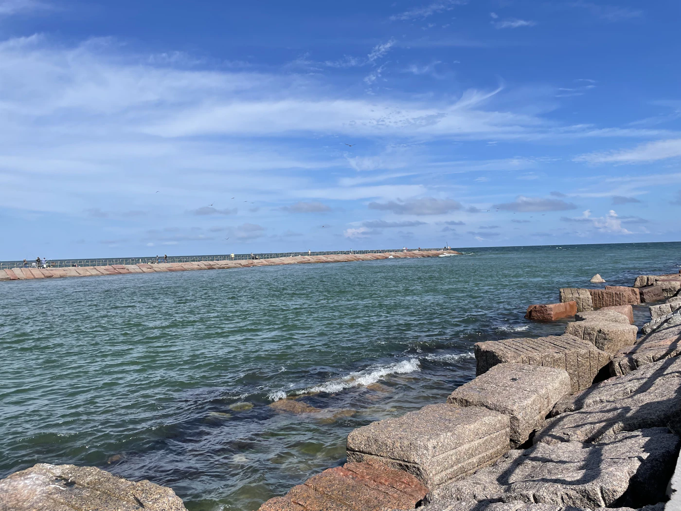 A rock jetty along a Coastal Bend channel