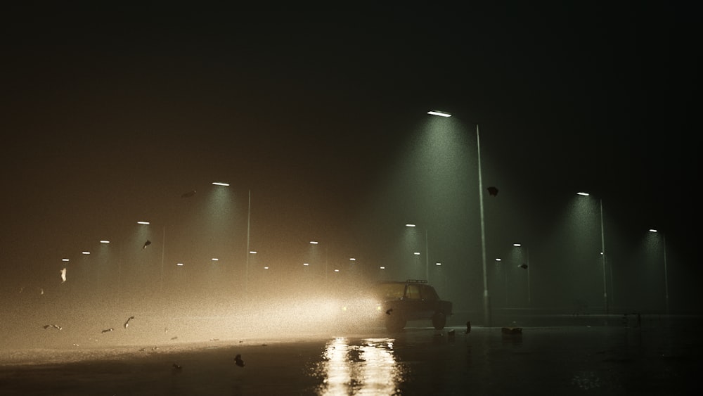 a car driving down a street at night