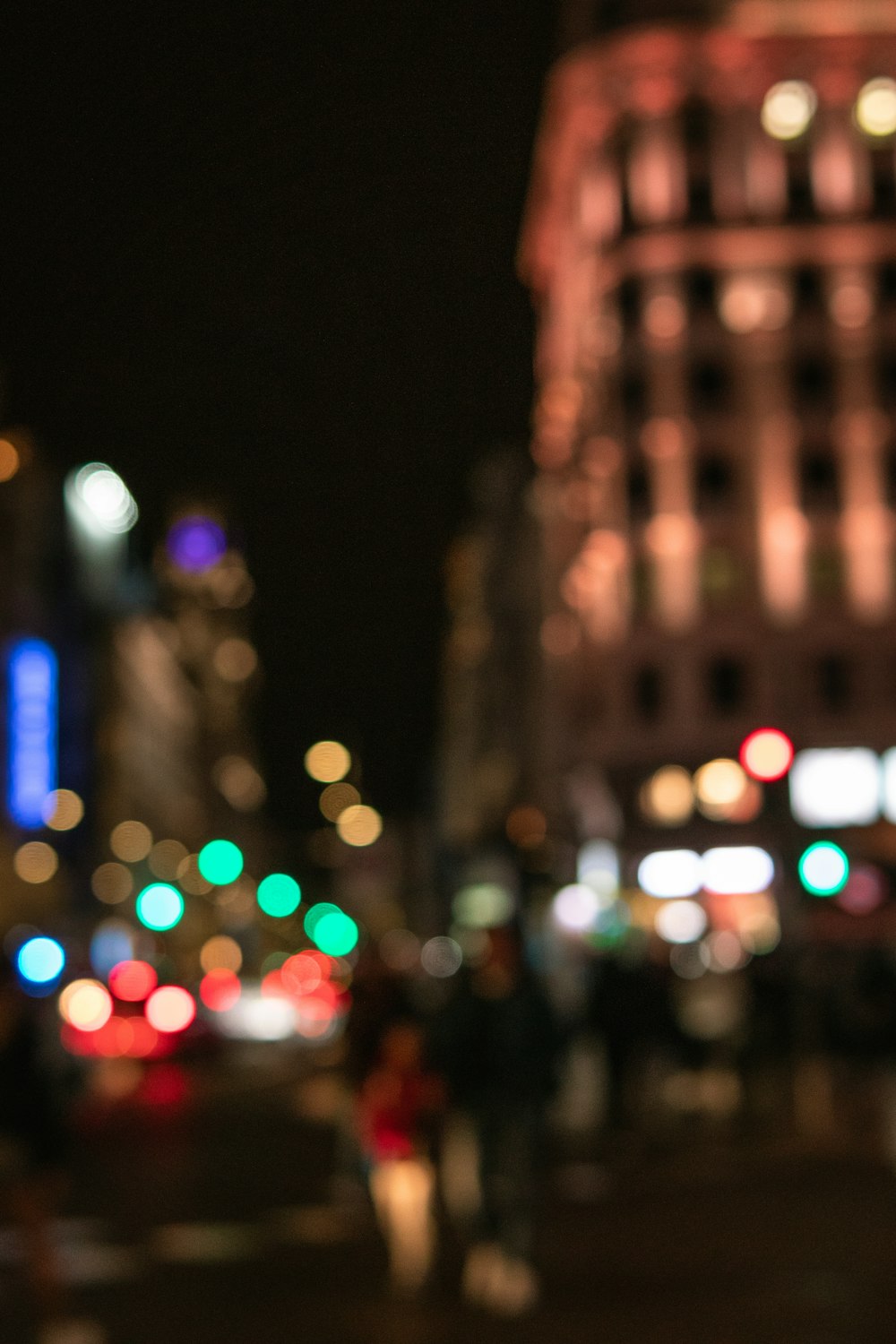 a blurry photo of a city street at night