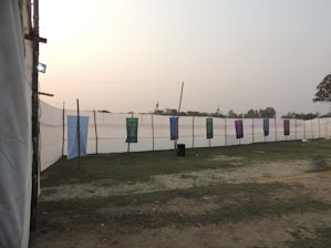Event signage and banners displayed at a vibrant outdoor corporate event.