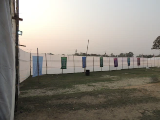 A scenic view of the venue exterior with banners welcoming visitors.