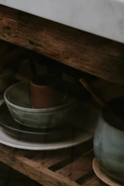 a white plate with a green bowl on top of it
