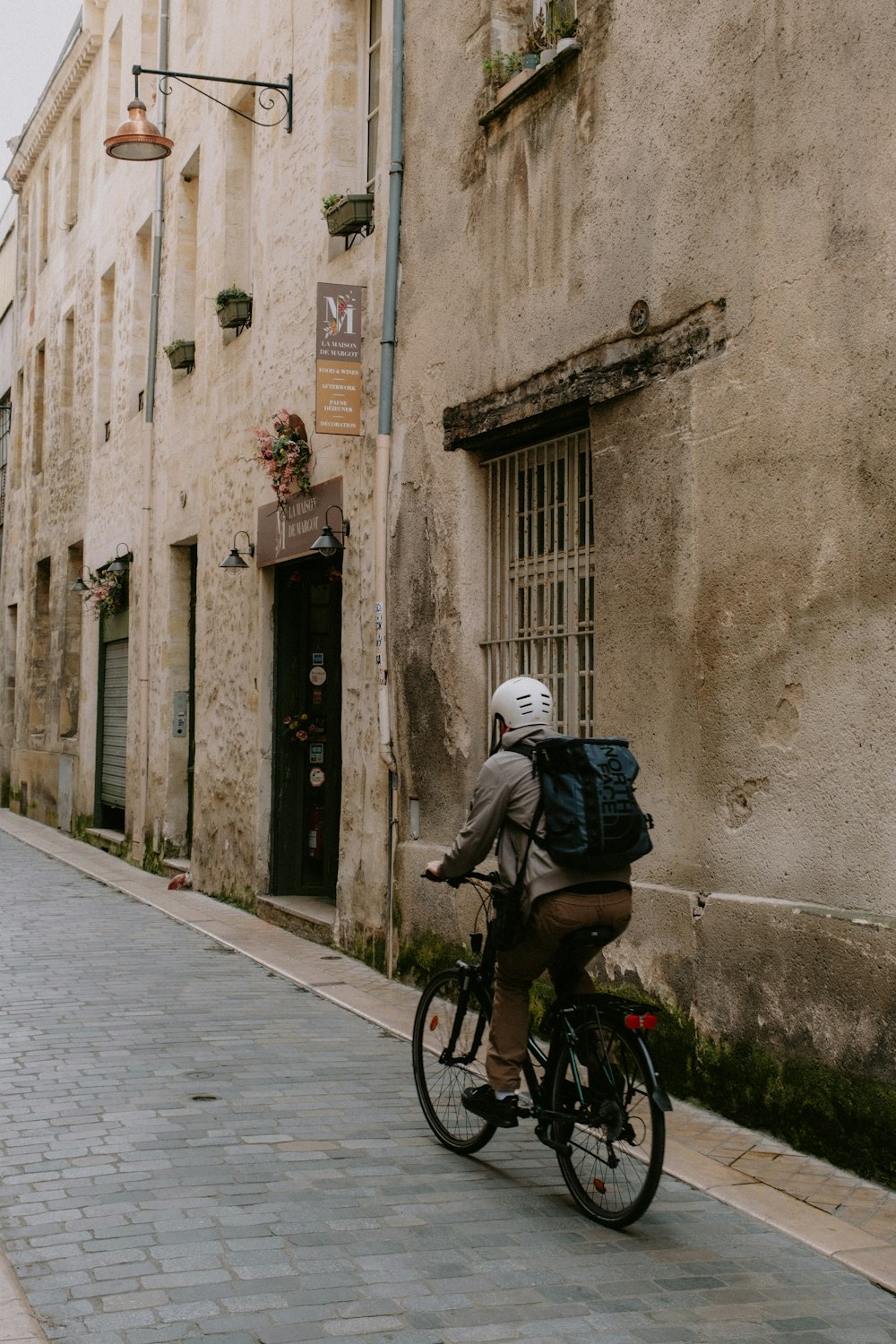 a person riding a bike down a street