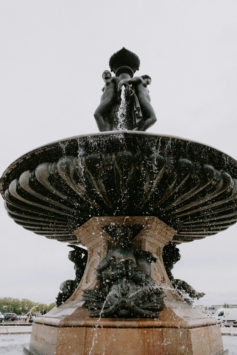 a fountain with a statue on top of it