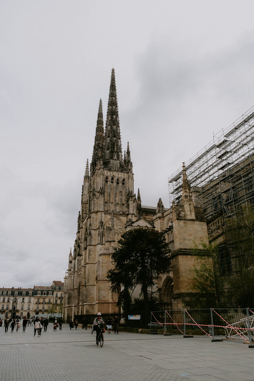 a group of people walking around a large cathedral