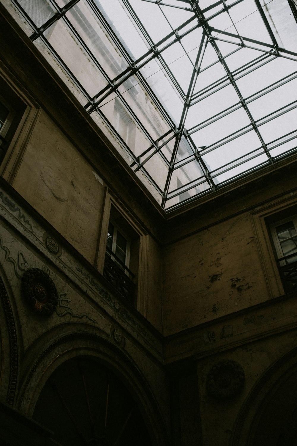 a building with a glass roof and a clock