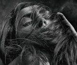 Close-up photo of the lead singer lost in a melancholic jazz-infused trip-hop moment.