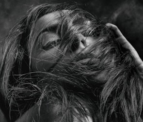 Close-up photo of the lead singer lost in a melancholic jazz-infused trip-hop moment.