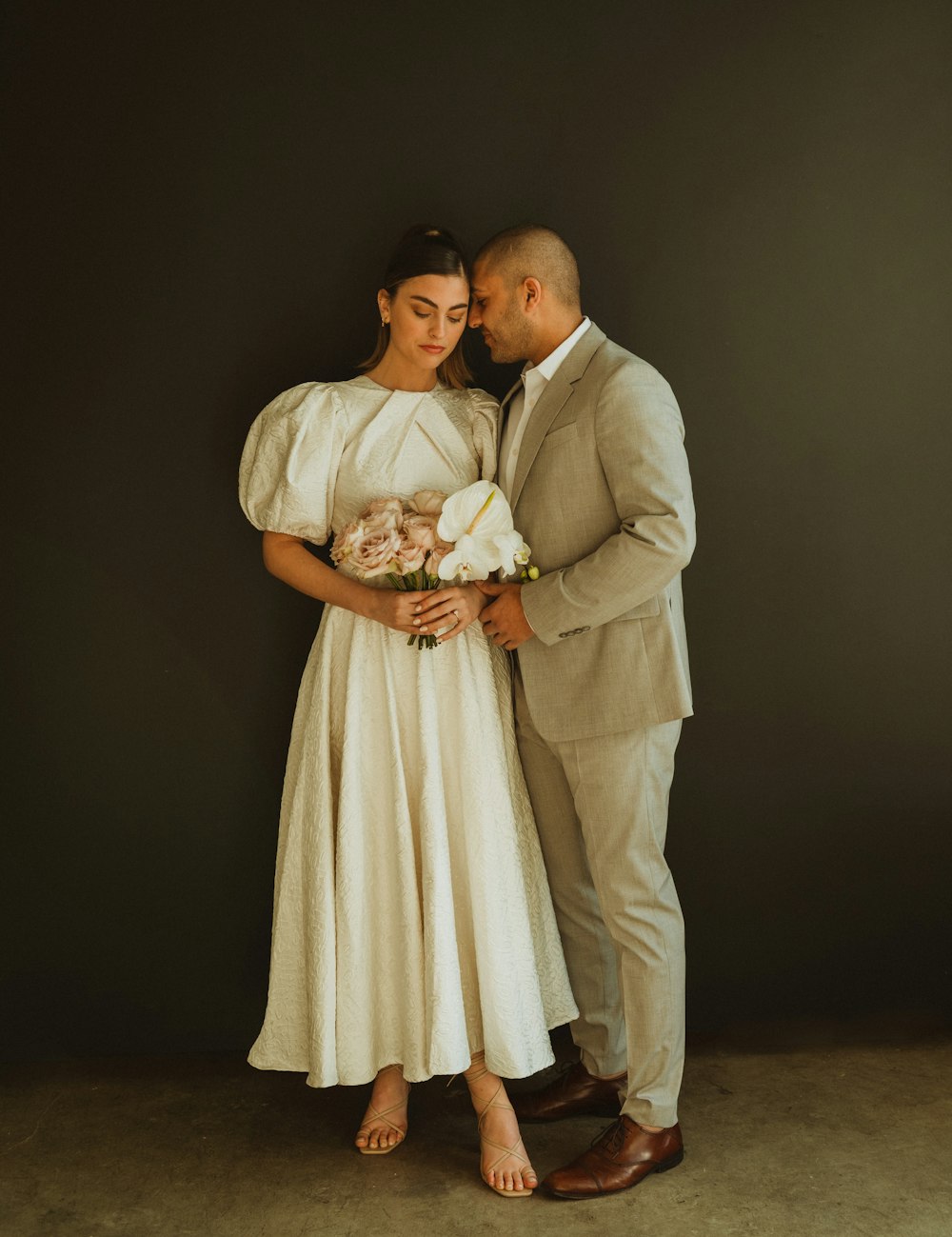 a man and a woman standing next to each other