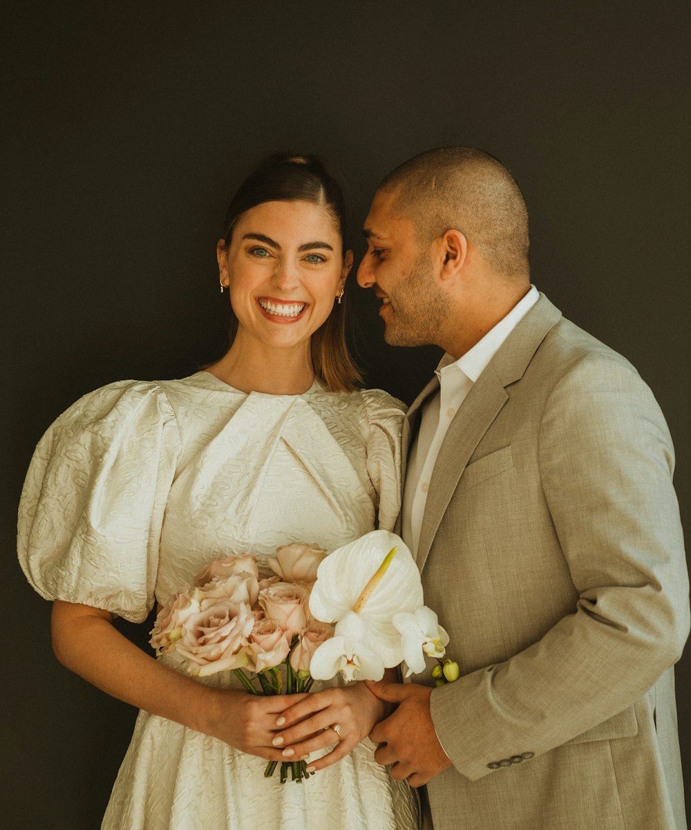 a man and a woman standing next to each other