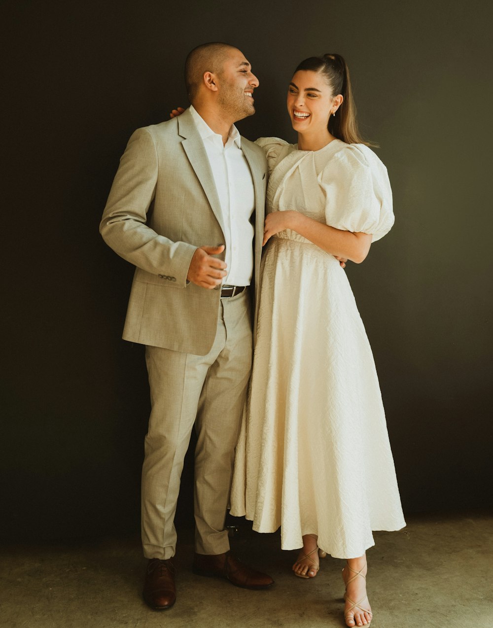 a man and a woman standing next to each other