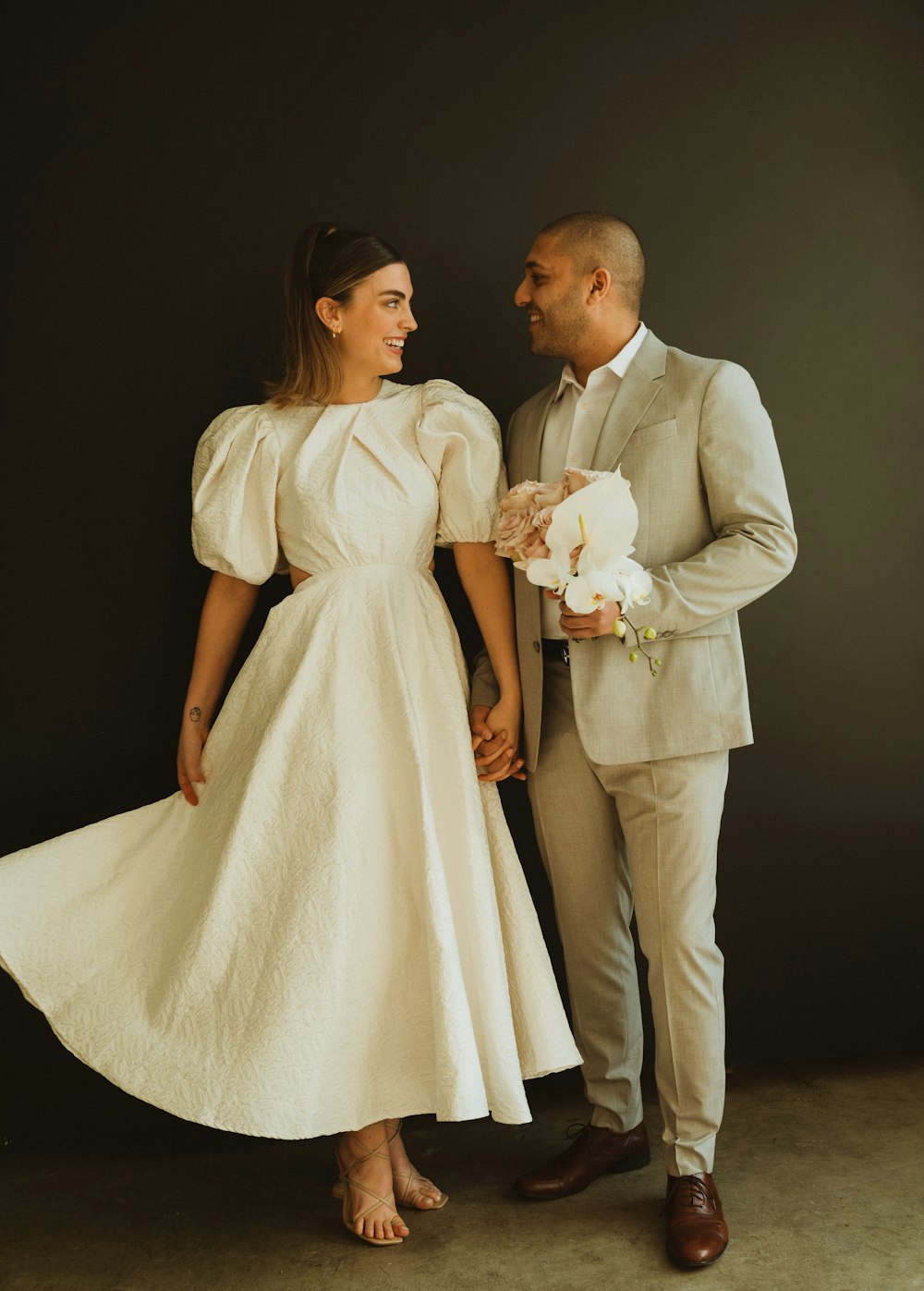 a man and a woman standing next to each other