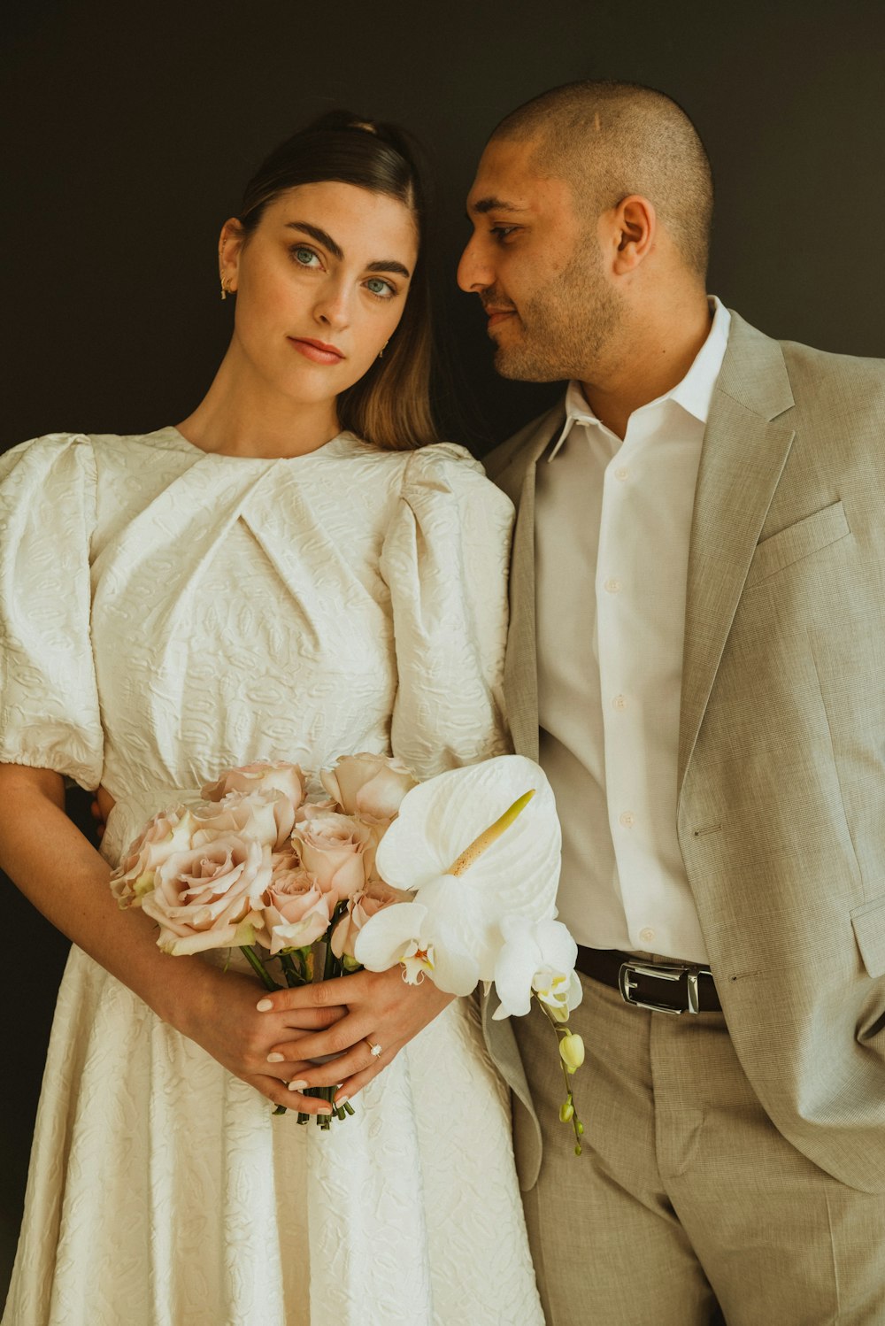 a man and a woman standing next to each other