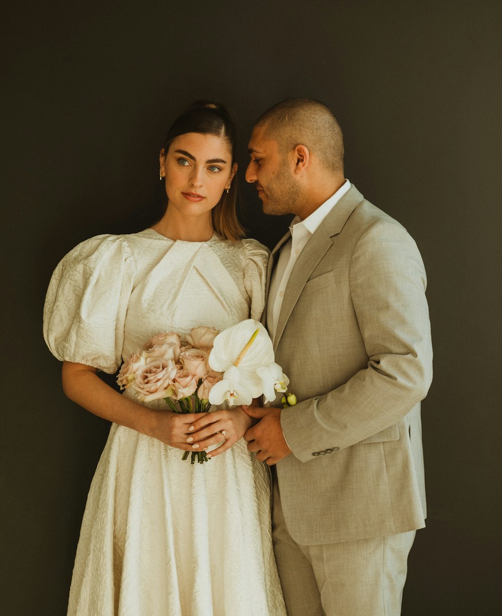 a man and a woman standing next to each other