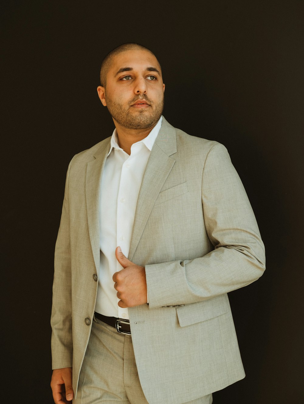 a man in a suit is posing for a picture