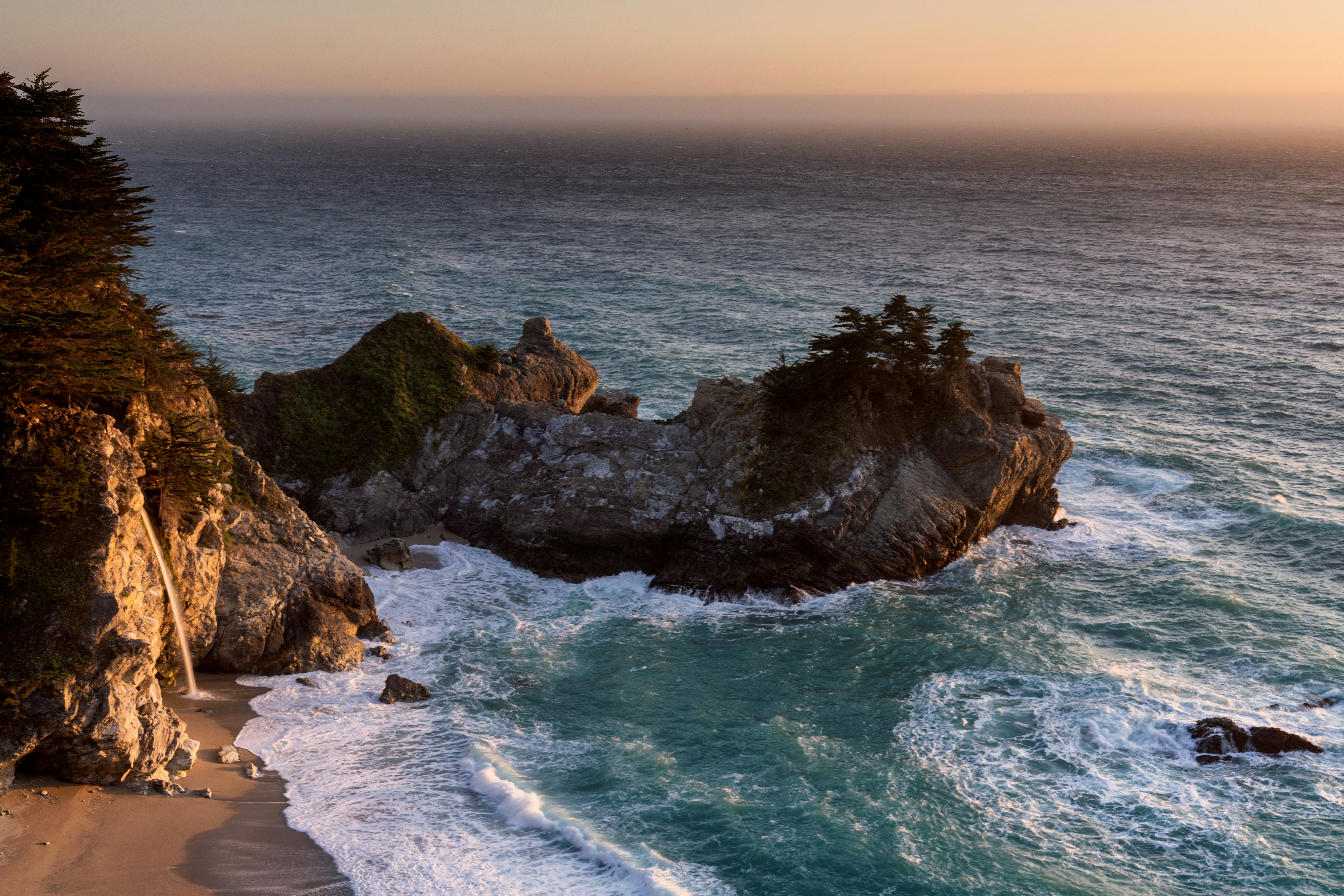 a view of the ocean from a cliff, 