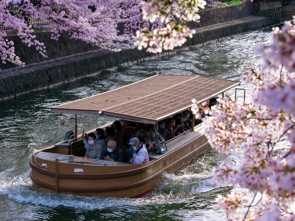 a group of people riding on the back of a boat