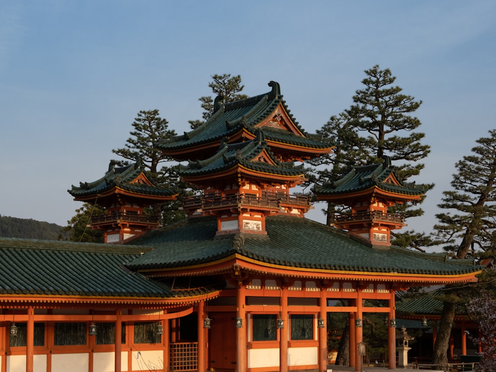 a large building with a lot of trees in front of it