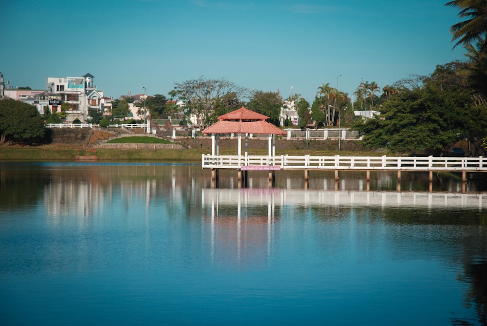 a white bridge over a body of water