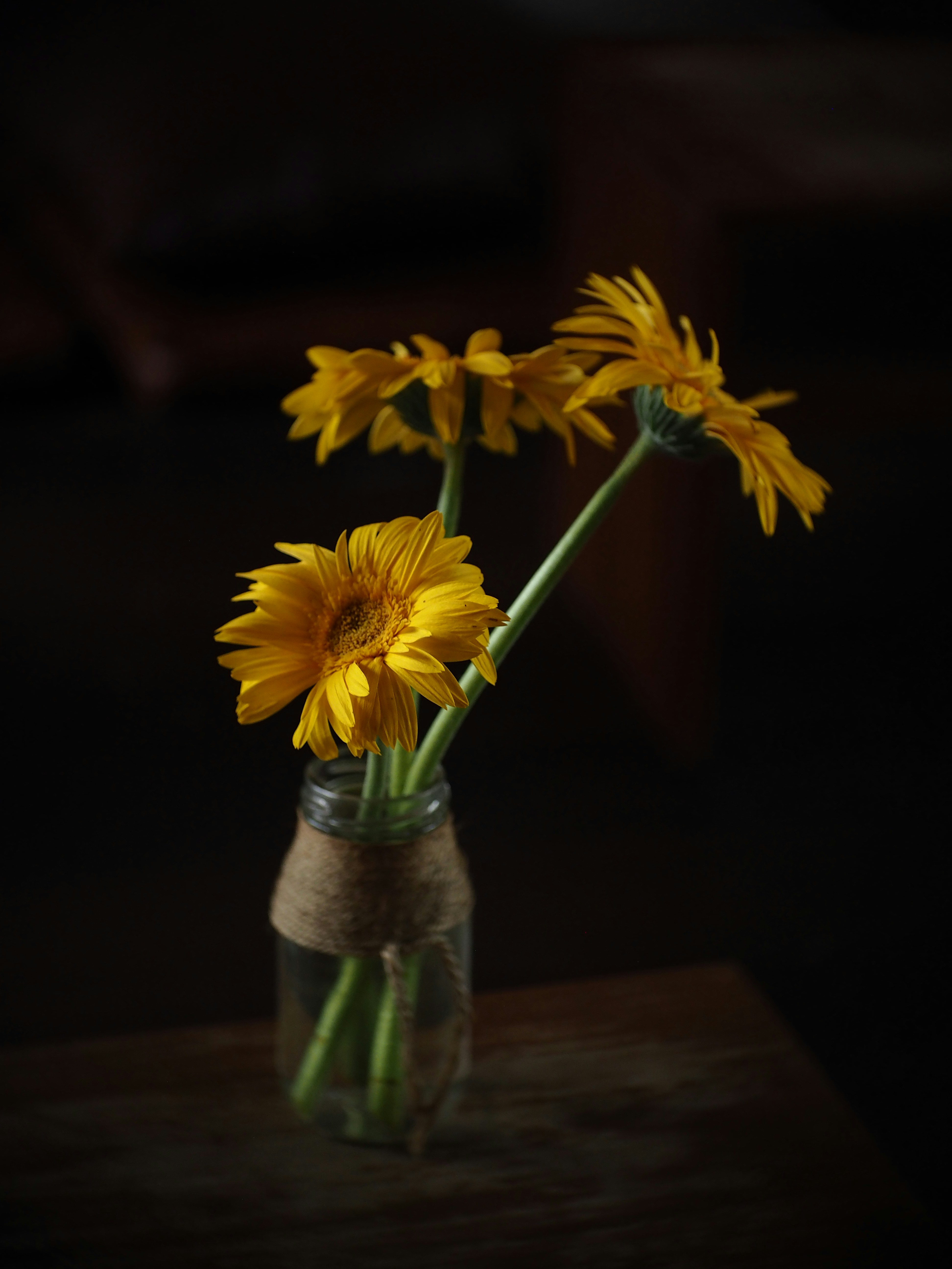 A vase filled with yellow flowers on top of a table photo – Free Flower ...