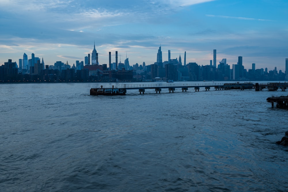 a large body of water with a city in the background