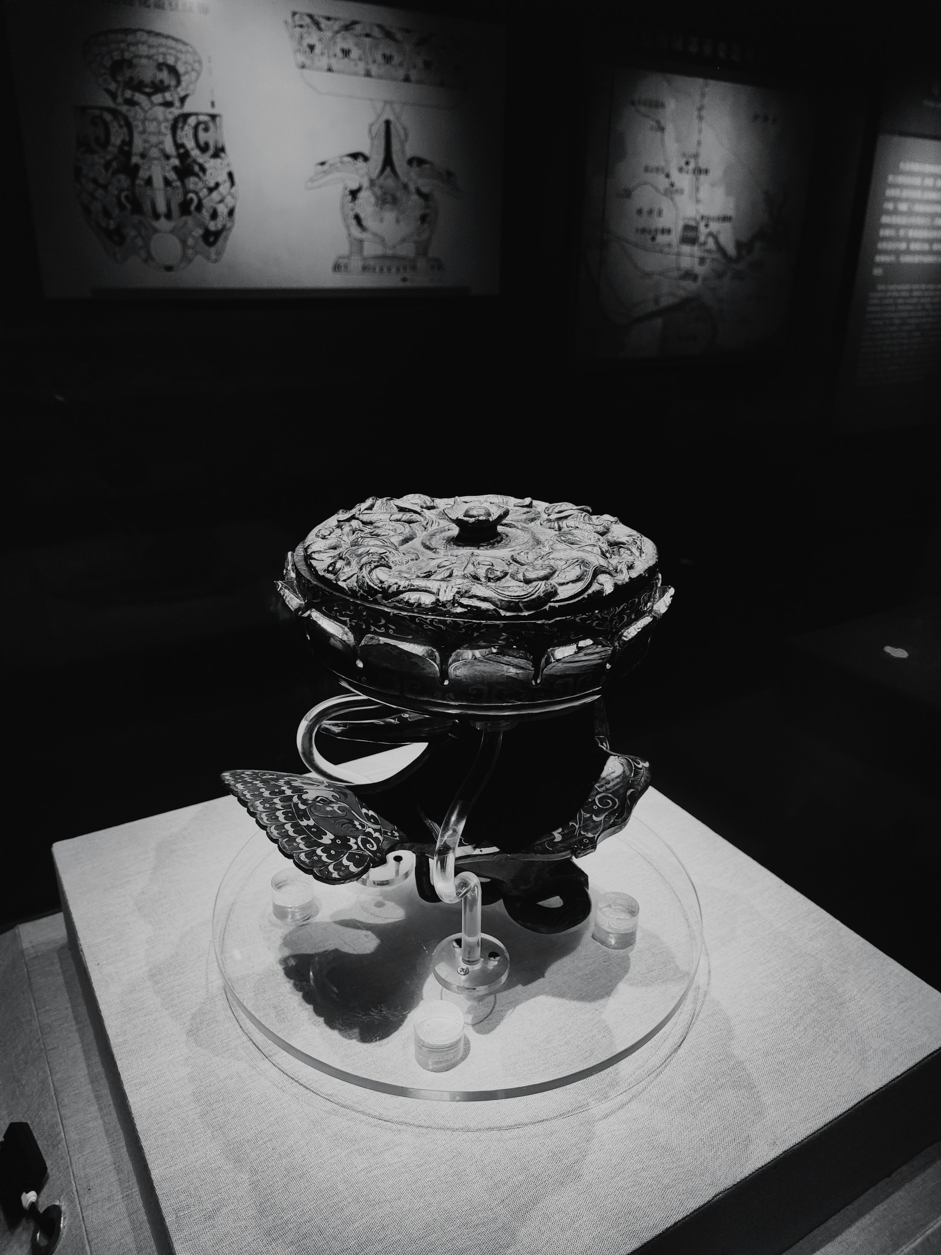 Ancient Spanish artifact displayed in a softly lit museum setting.