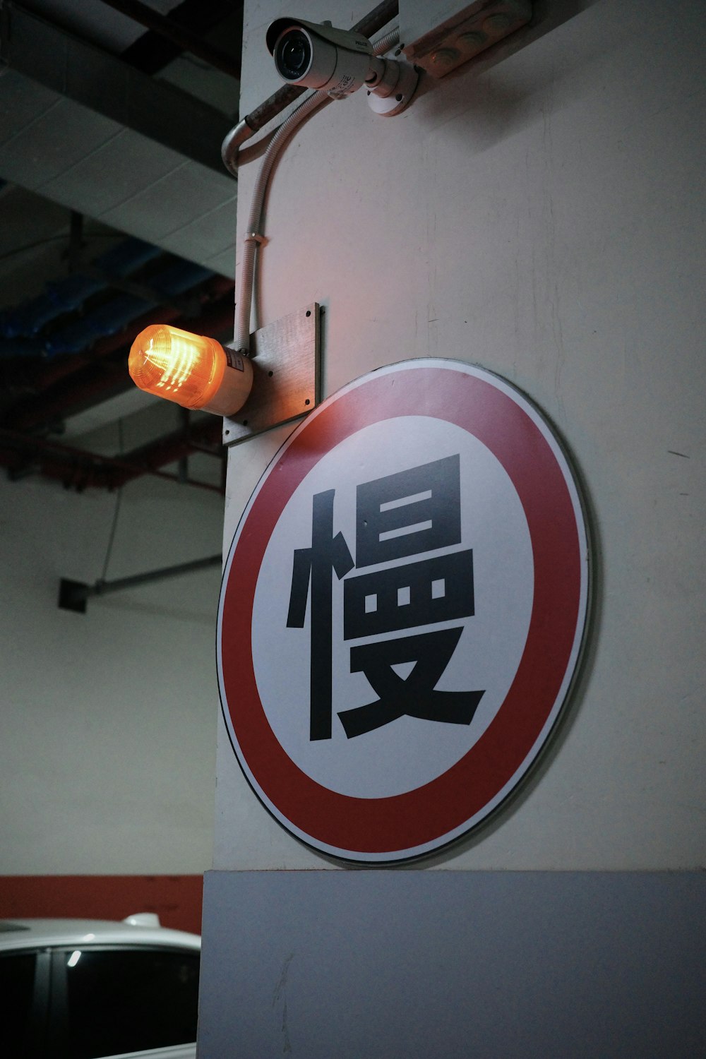 a traffic light hanging from the side of a building