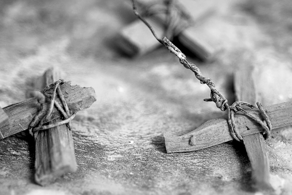 a black and white photo of two wooden crosses