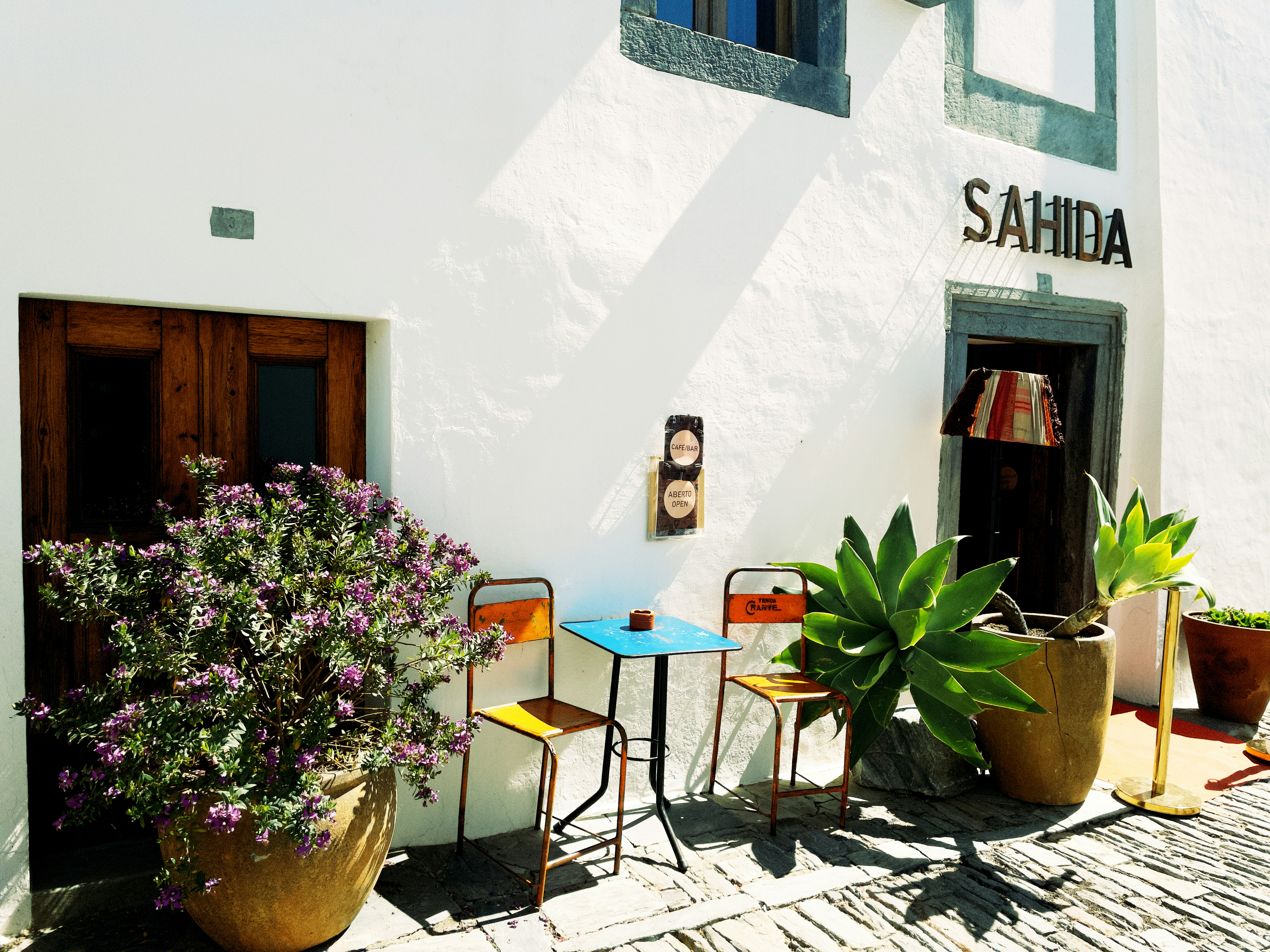 a table and chairs outside of a building