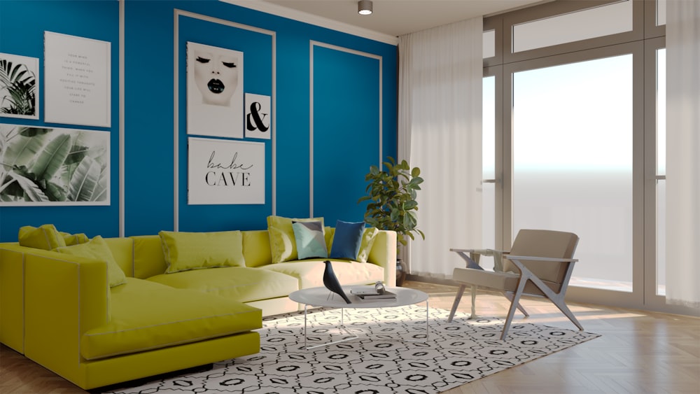a living room with blue walls and a green couch