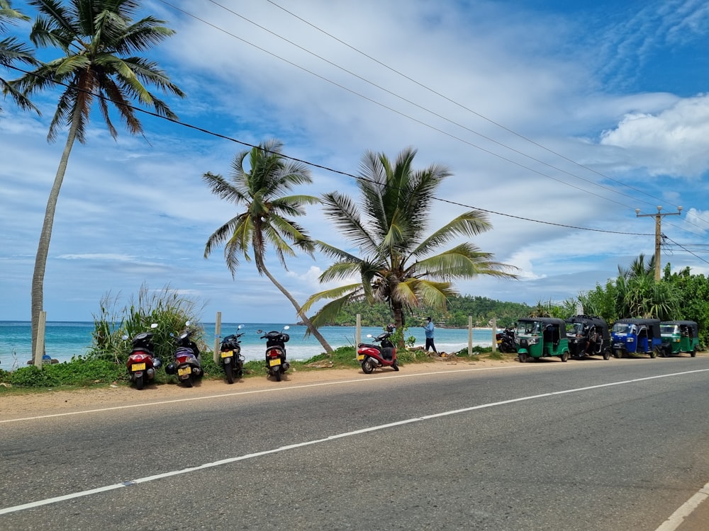 a group of motorcycles parked on the side of a road