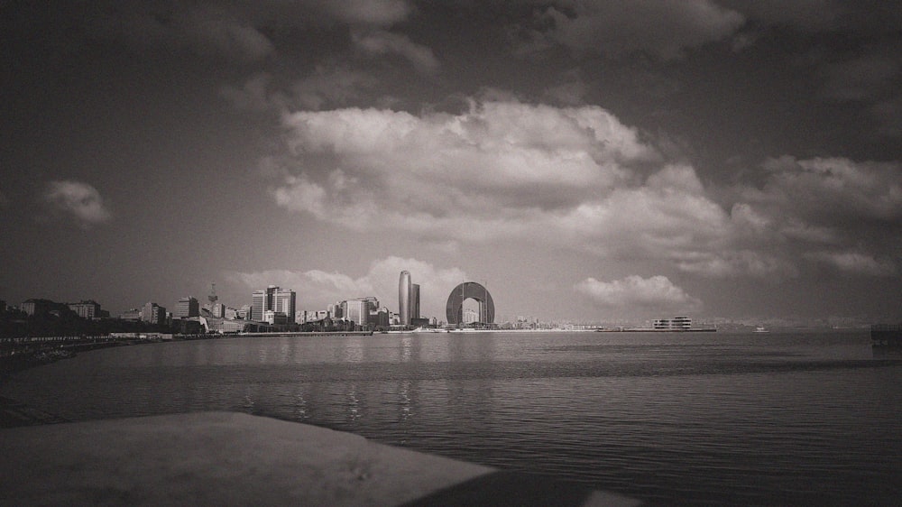 a large body of water with a city in the background