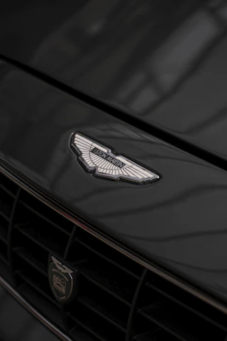 Elegant Bentley car front grille shining under soft light.