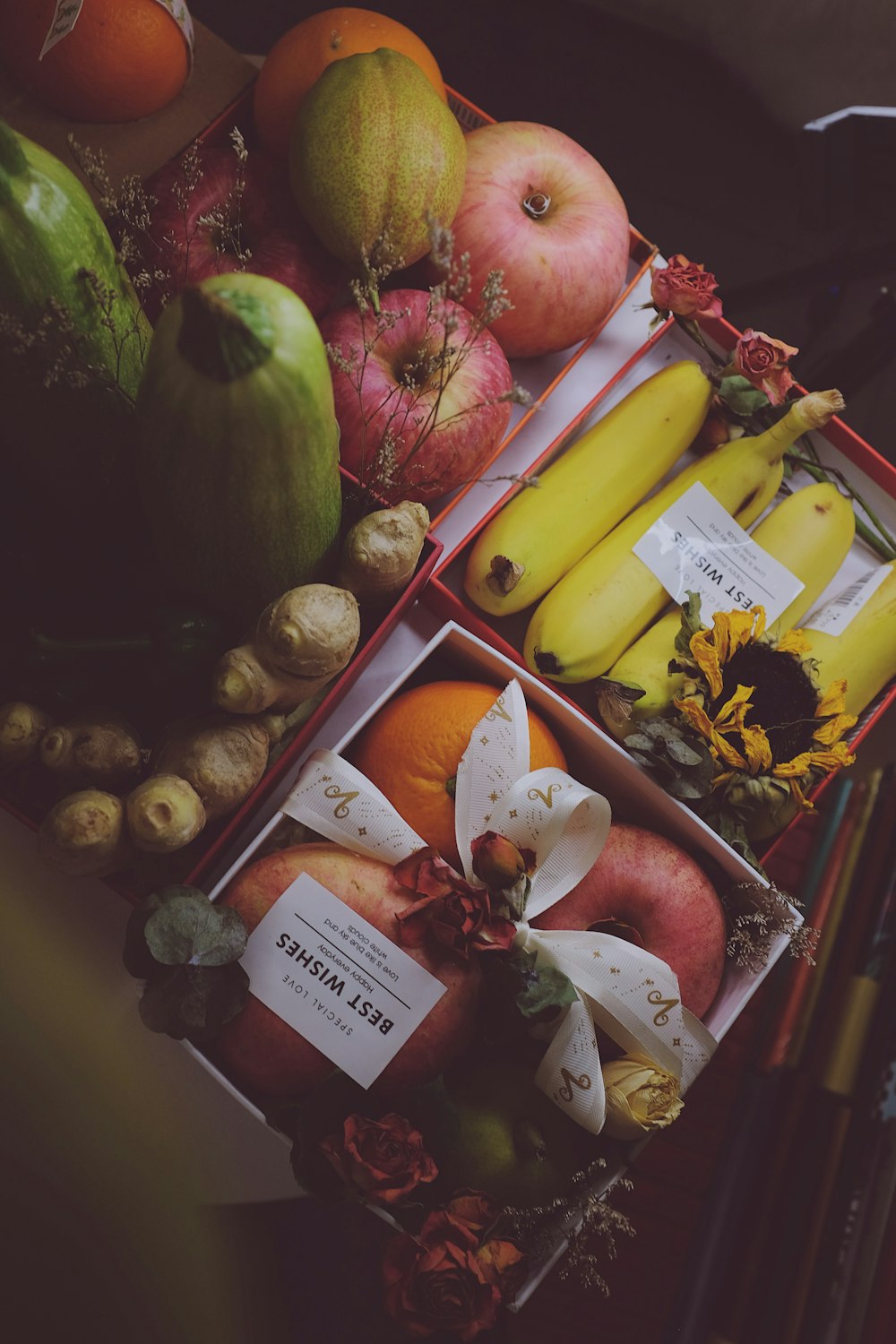 a table topped with boxes of fruit and vegetables