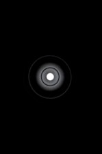 Minimalist graphic showing a single bright focal center surrounded by subtle signals.