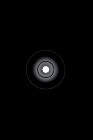 Minimalist graphic showing a single bright focal center surrounded by subtle signals.