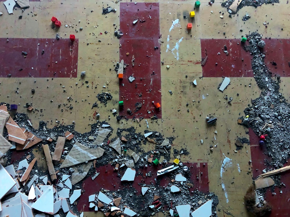 a red and white checkered floor covered in debris