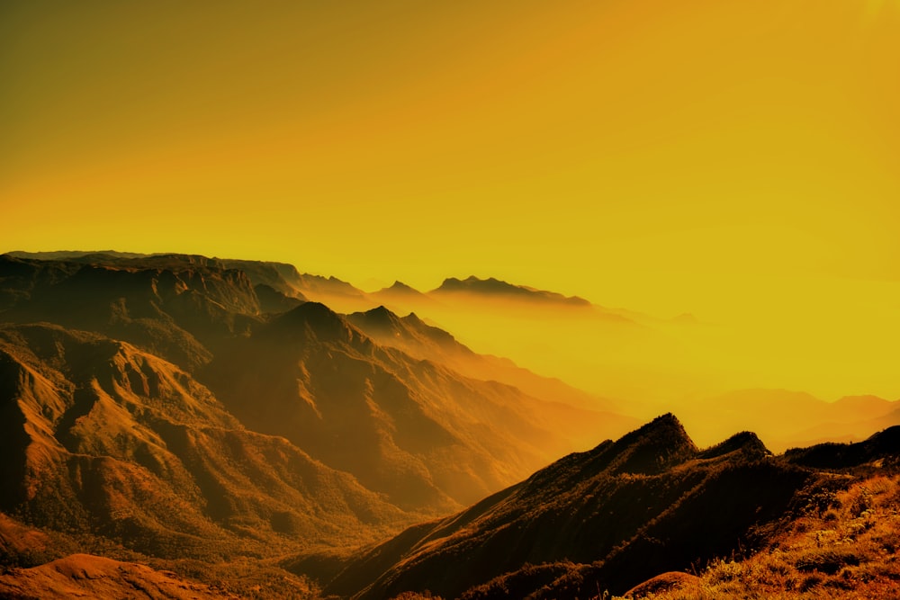 a view of a mountain range at sunset