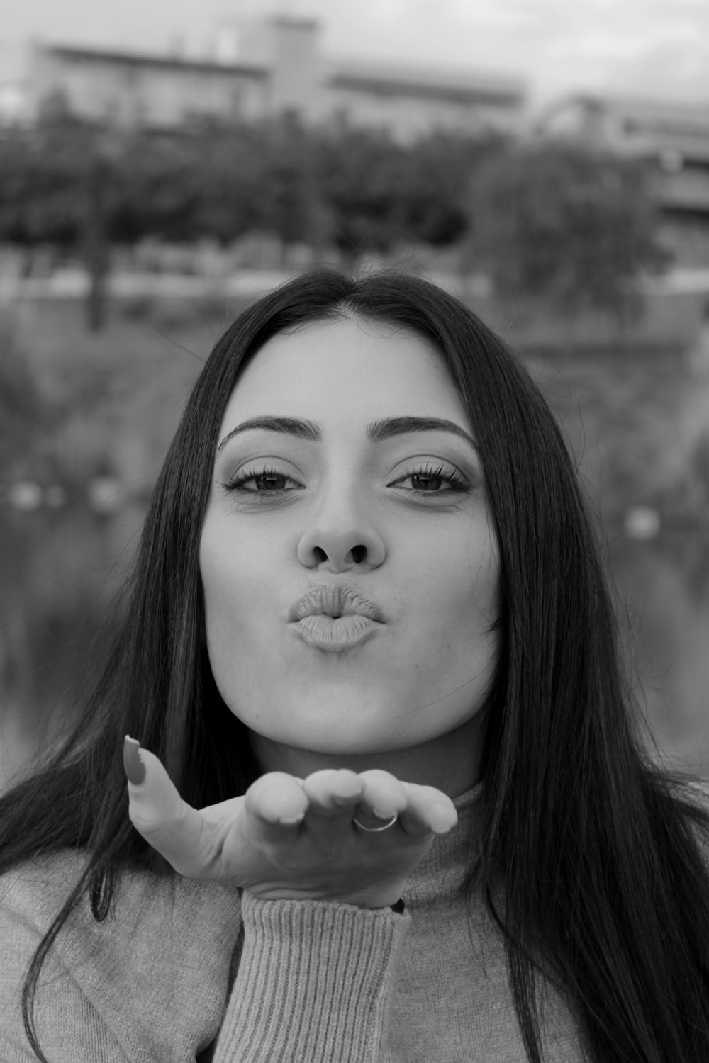 a woman making a funny face with her hands