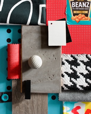 a table topped with lots of different types of fabric